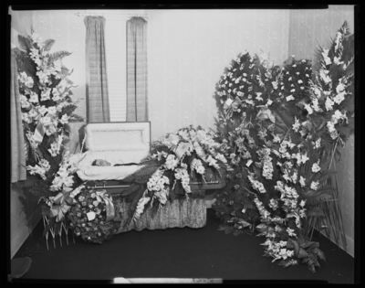 Mr. W.J. Ham; corpse; open casket surrounded by                             flowers