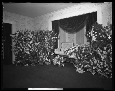 Mrs. Anna Miller; corpse; open casket surrounded by                             flowers