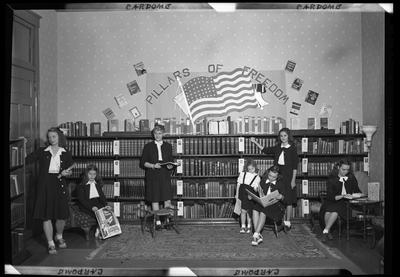 Cardome Academy (Georgetown, Kentucky); group of women gathered                             around bookcases