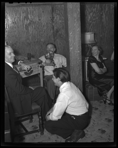 R.J. Long (Lafayette Studios); Thanksgiving Dinner; men sitting                             and drinking