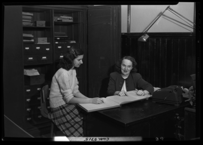 Georgetown College; Belle of the Blue; interior; office; two                             women sitting at a desk