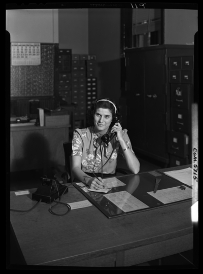 Georgetown College; Belle of the Blue; interior; office; women                             sitting at a desk