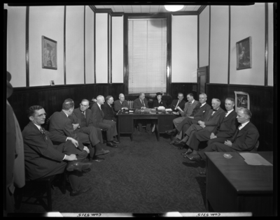 Georgetown College; Belle of the Blue; interior; group of men                             sitting in a small room