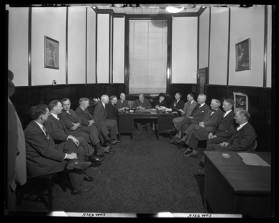Georgetown College; Belle of the Blue; interior; group of men                             sitting in a small room