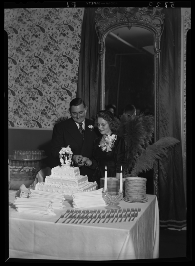 Joseph Walle; wedding; Phoenix Hotel; interior; bride and groom                             cutting wedding cake