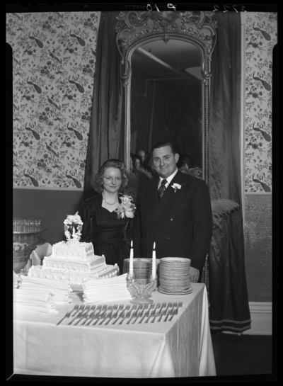 Joseph Walle; wedding; Phoenix Hotel; interior; bride and groom                             standing next to wedding cake