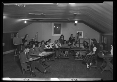 Georgetown College; Kappa Pi Art Room; interior; group drawing                             model standing next to table