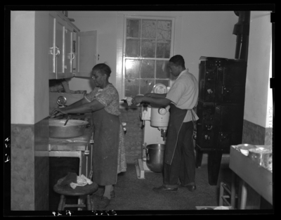 Georgetown College; interior; Ellen and cooks in the                             kitchen