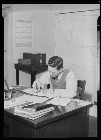 Georgetown College; Russell writing at desk