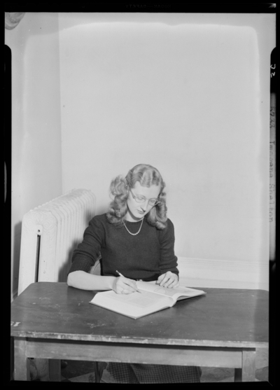 Georgetown College; Imogene Shelton sitting at desk