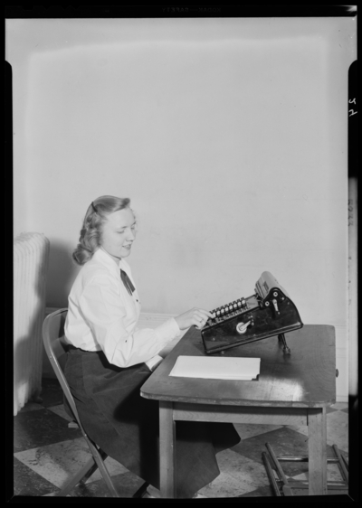 Georgetown College; women with adding machine