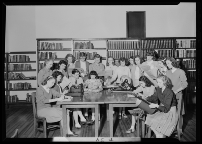 Garth High School, Georgetown; news staff group gathered in                             library