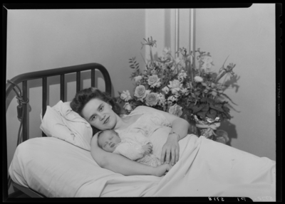 Linda Lace Lunsford; woman laying in bed with baby