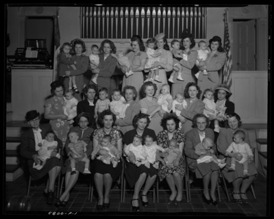Methodist Christian Church; interior; seated women holding                             babies