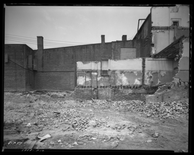 F. W. Woolworth, building being torn down; empty lot,                             debris