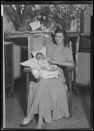 Mrs. Alvin New & baby in hospital; woman holding                             baby