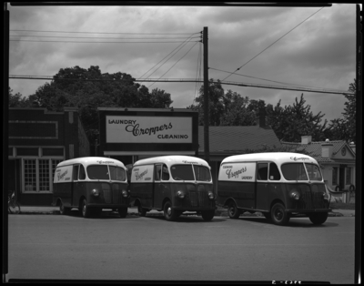International Harvester Company; Cropper' Laundry Service,                             105 Walton; exterior; dry cleaning delivery trucks parked in front of                             business