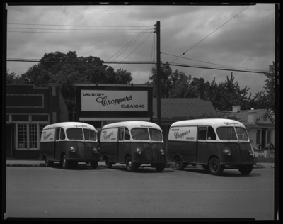 International Harvester Company; Cropper' Laundry Service,                             105 Walton; exterior; dry cleaning delivery trucks parked in front of                             business