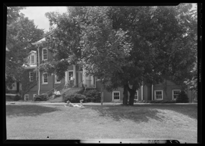 Georgetown College; campus scene; exterior; view of grass (lawn)                             and unidentified building; various students throughout the                             image