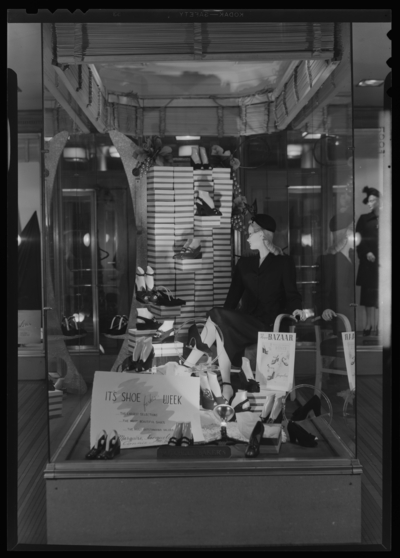 Mitchell, Baker & Smith Company (department store),                             230-232 West Main; exterior; window display