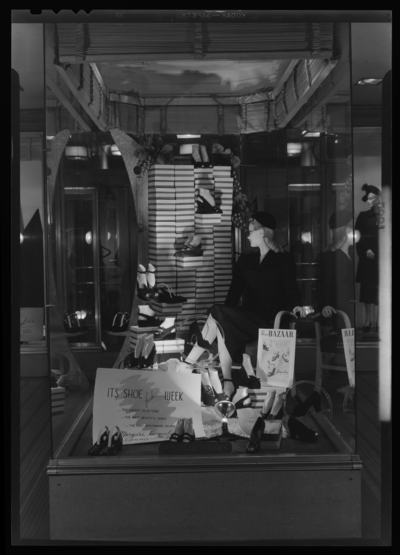 Mitchell, Baker & Smith Company (department store),                             230-232 West Main; exterior; window display