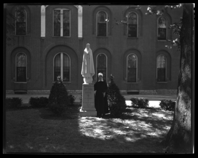 St. Joseph's Hospital, 544 West Second (2nd) Street;                             exterior; nun standing by a statue of 