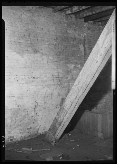 F. W. Woolworth building; exterior; construction work; 106-110                             West Main; interior; brick wall and wooden post beam