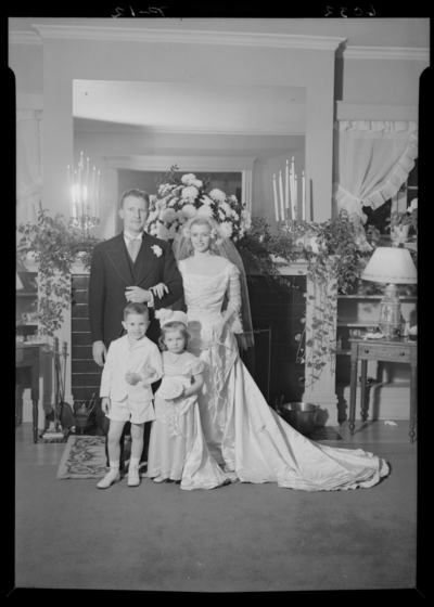 Carojean (Carolyn) Elsey; Wedding; interior; bride, groom, two                             children; group portrait