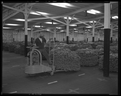 Clay Warehouse #1 (Tobacco) (South Broadway); interior; man                             operating a load dispatcher model SD3054; int
