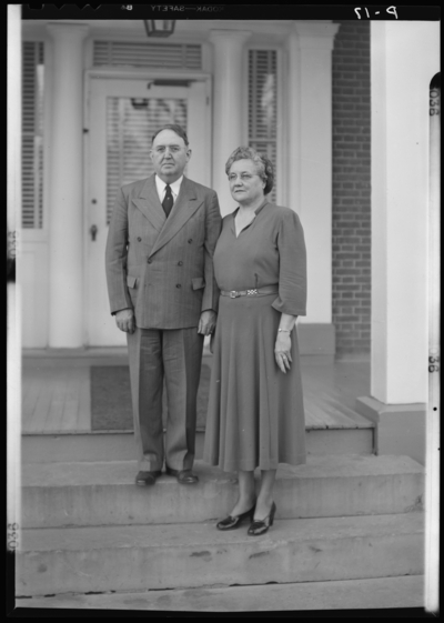 Methodist Home (Versailles, Kentucky); exterior; man and woman                             standing on steps