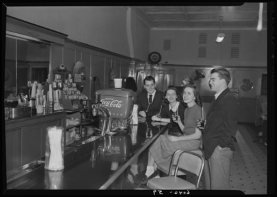 Belle of the Blue; Georgetown College; interior; soda fountain;                             group gathered at the counter
