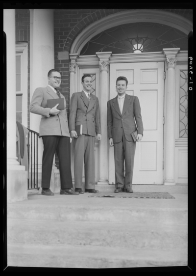 Belle of the Blue; Georgetown College; exterior; group standing                             next to building entranceway