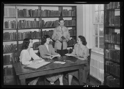 Belle of the Blue; Georgetown College; library; interior; group                             gathered around a table