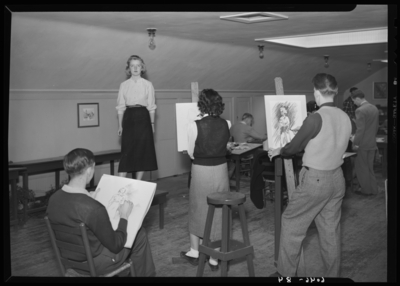 Belle of the Blue; Georgetown College; interior; clothed model                             posing for art students