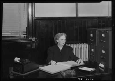 Belle of the Blue; Georgetown College; interior; women sitting at                             a desk