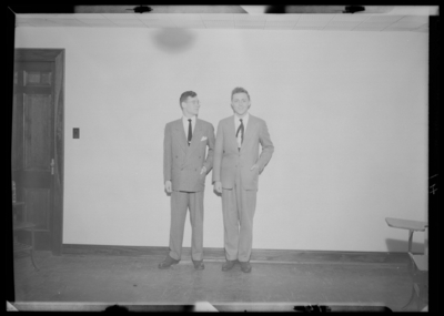 Belle of the Blue; Georgetown College; interior; portrait of two                             men standing