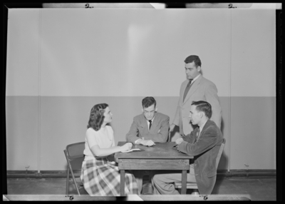 Belle of the Blue; Georgetown College; interior; group gathered                             around a table