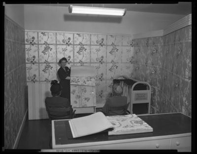 Sherwin-Williams Company (350 West Main); interior; sales woman                             showing two women wallpaper samples