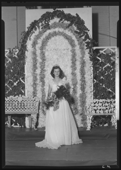 Belle of the Blue; May Day Program; Georgetown College; queen                             holding a bouquet of roses