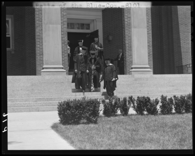 Graduation; Belle of the Blue; Georgetown College; exterior;                             graduates gathered around entrance to building