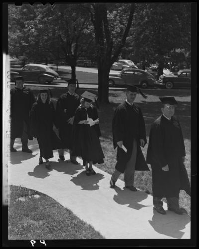 Graduation; Belle of the Blue; Georgetown College; exterior;                             graduates lined up walking into building