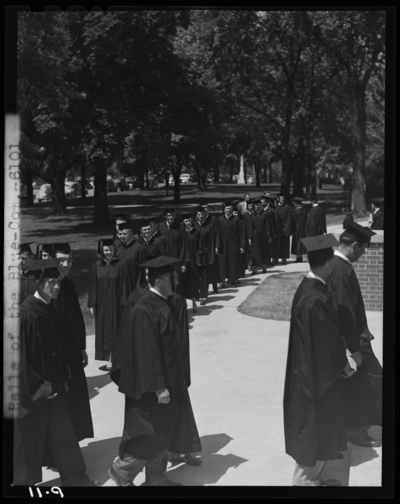 Graduation; Belle of the Blue; Georgetown College; exterior;                             graduates lined up walking into building