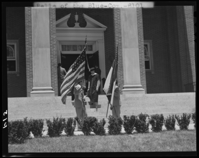 Graduation; Belle of the Blue; Georgetown College; exterior; flag                             bearer standing next to entrance to building