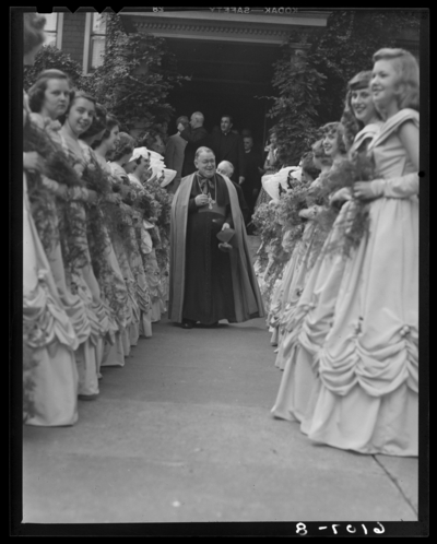 Cardome Academy (Georgetown, Kentucky); exterior; priest walking                             between row of women
