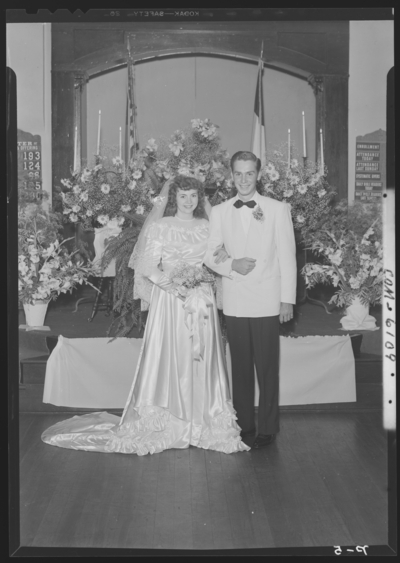 Tuttle, Mr. & Mrs. Fred; wedding; church; interior; bride                             and groom