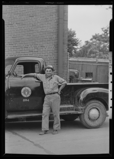 Central Kentucky Natural Gas Company (166 Walnut); exterior;                             portrait of William Ledford standing next to pickup truck
