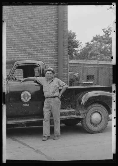 Central Kentucky Natural Gas Company (166 Walnut); exterior;                             portrait of William Ledford standing next to pickup truck