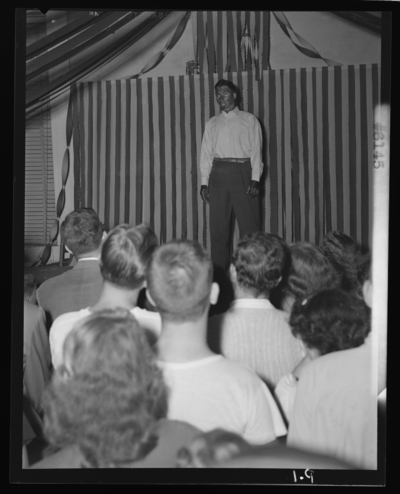 Belle of the Blue; Georgetown College; interior; man on                             stage