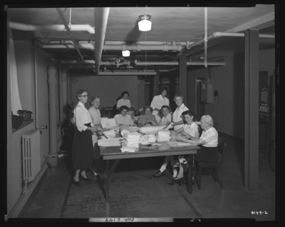 Good Samaritan Hospital, 310-330 South Limestone; Nurses Home;                             interior; basement; group of nurses rolling bandages
