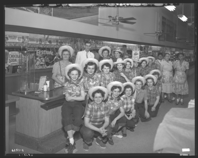 S.S. Kresge & Company (156, 250 West Main); interior;                             large group dressed in country attire gathered in front of soda                             fountain; group portrait